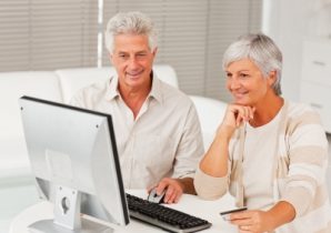Elderly couple shopping from home using the internet