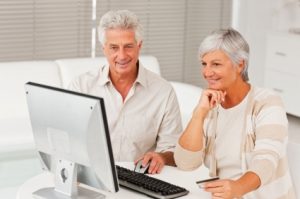 Elderly couple shopping from home using the internet